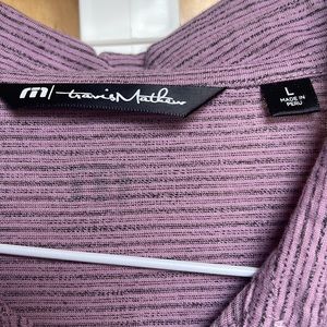 Wine colored Travis Mathew’s golf shirt